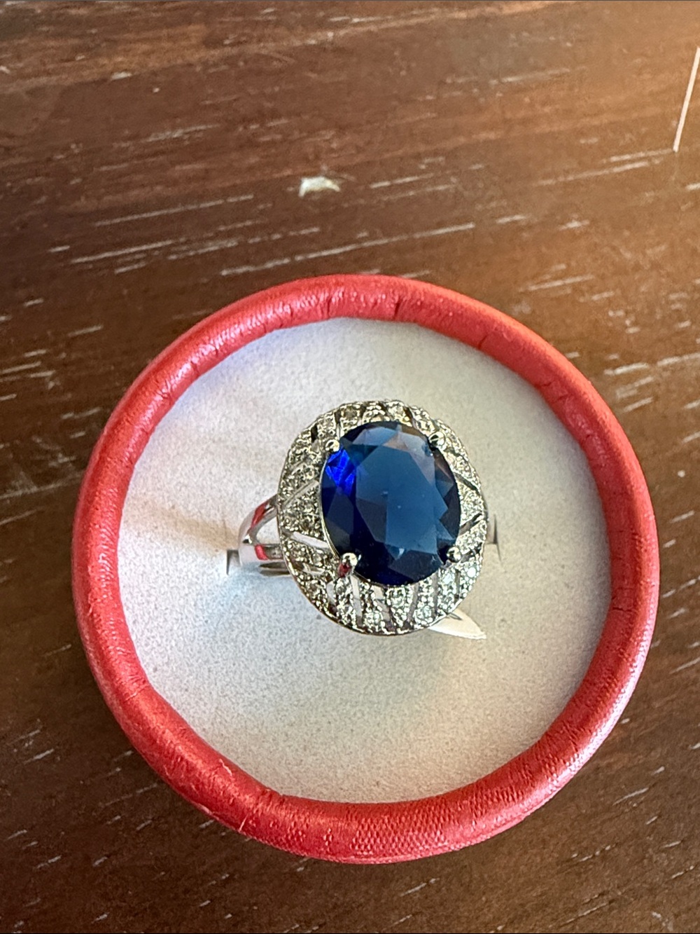 Sterling Silver Ring with Deep Blue Oval Gemstone and Halo